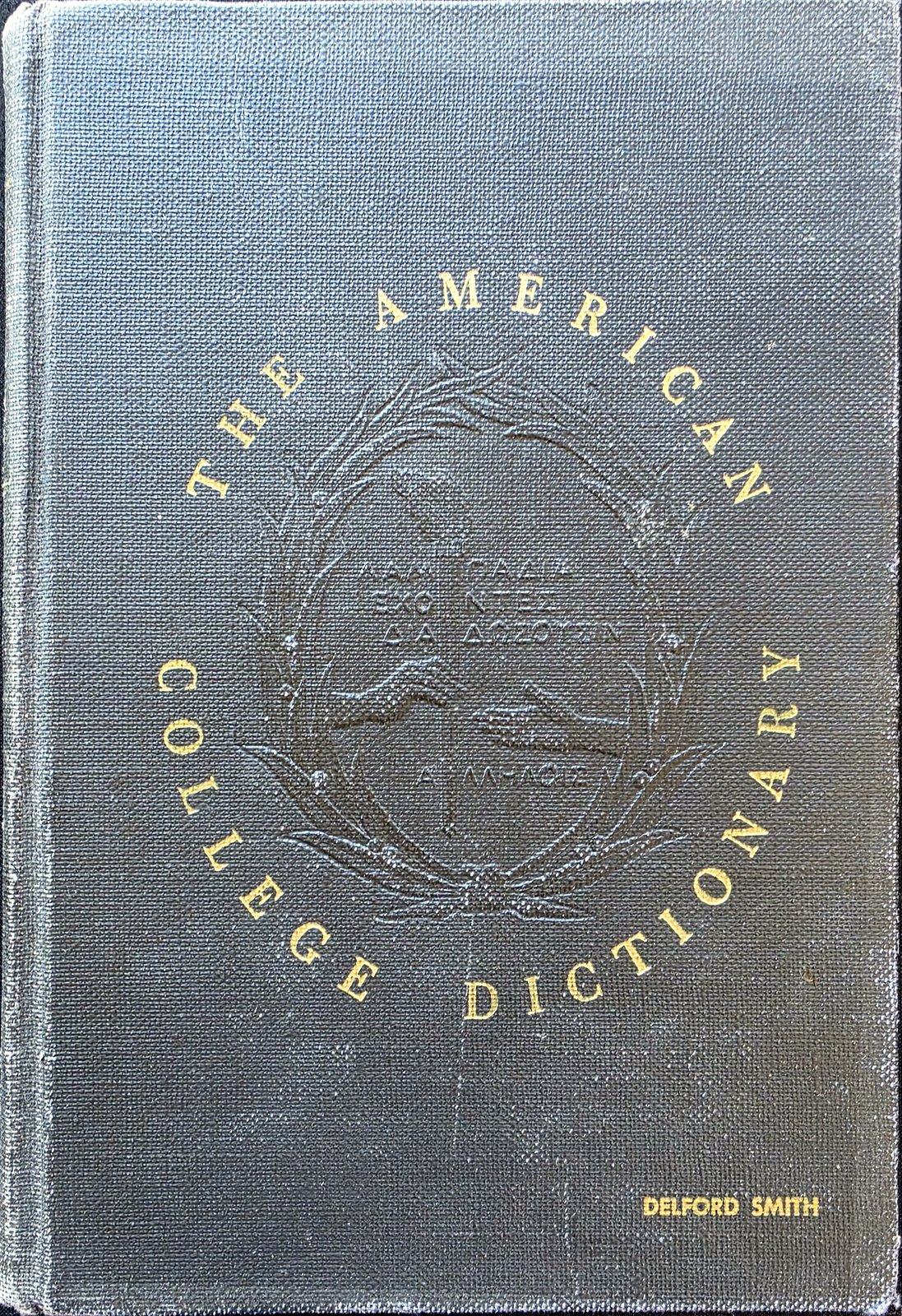 Dark cloth cover of The American College Dictionary with gold lettering around a blind-stamped seal, and DELFORD SMITH stamped in gold at the lower right