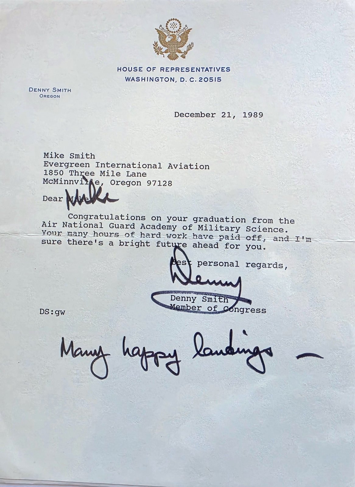 Typed letter on House of Representatives letterhead from Denny Smith, Oregon, dated December 21, 1989, to Mike Smith at Evergreen International Aviation, congratulating him on his graduation from the Air National Guard Academy of Military Science, signed Denny, with Many happy landings handwritten at the bottom