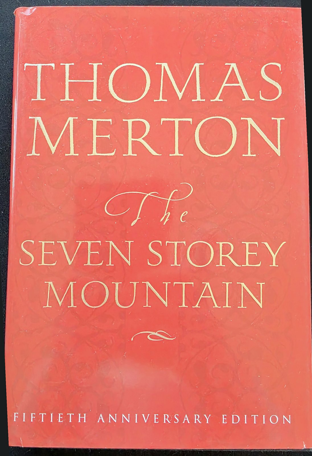 Red cover of The Seven Storey Mountain by Thomas Merton, Fiftieth Anniversary Edition