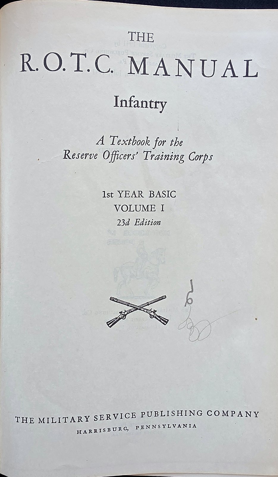 Title page of The R.O.T.C. Manual, Infantry, A Textbook for the Reserve Officers' Training Corps, 1st Year Basic, Volume I, 23d Edition, The Military Service Publishing Company, Harrisburg, Pennsylvania, with crossed rifles and a handwritten pencil marking