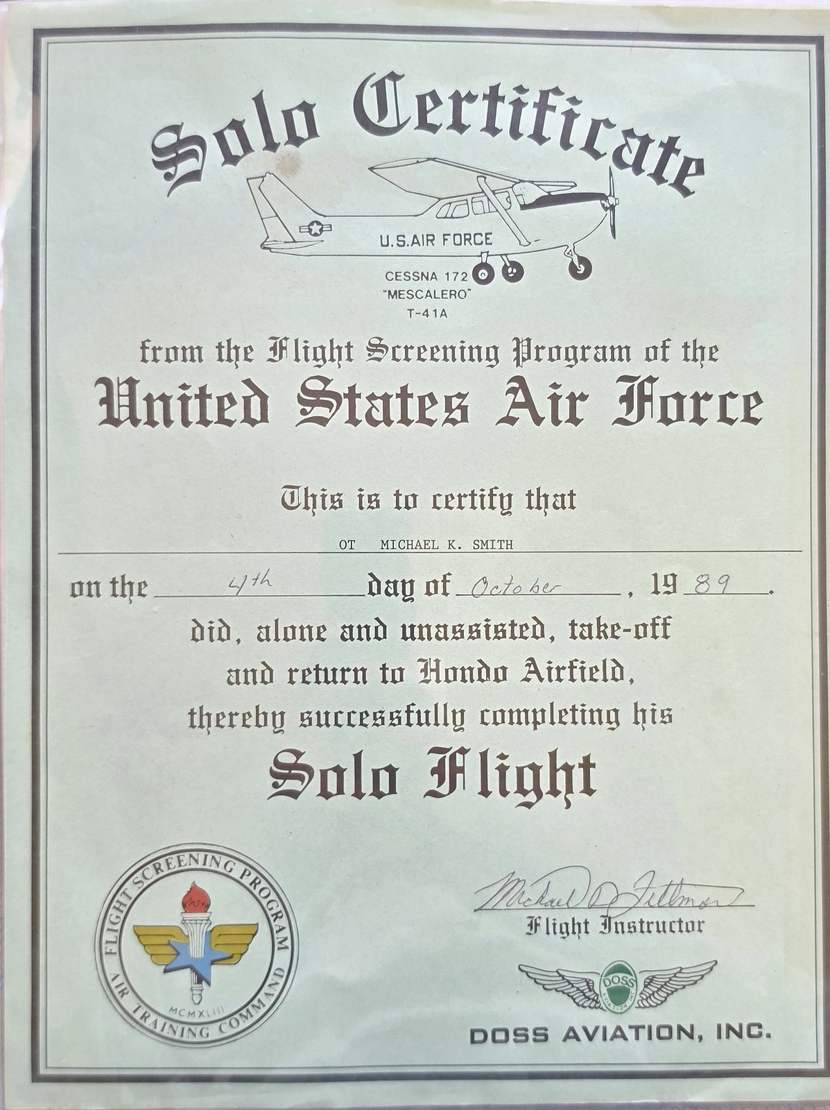 Solo Certificate from the Flight Screening Program of the United States Air Force, with a drawing of a U.S. Air Force Cessna 172 Mescalero T-41A, certifying that OT Michael K. Smith soloed at Hondo Airfield on the 4th day of October, 1989, with the Flight Screening Program seal and the Doss Aviation, Inc. wings