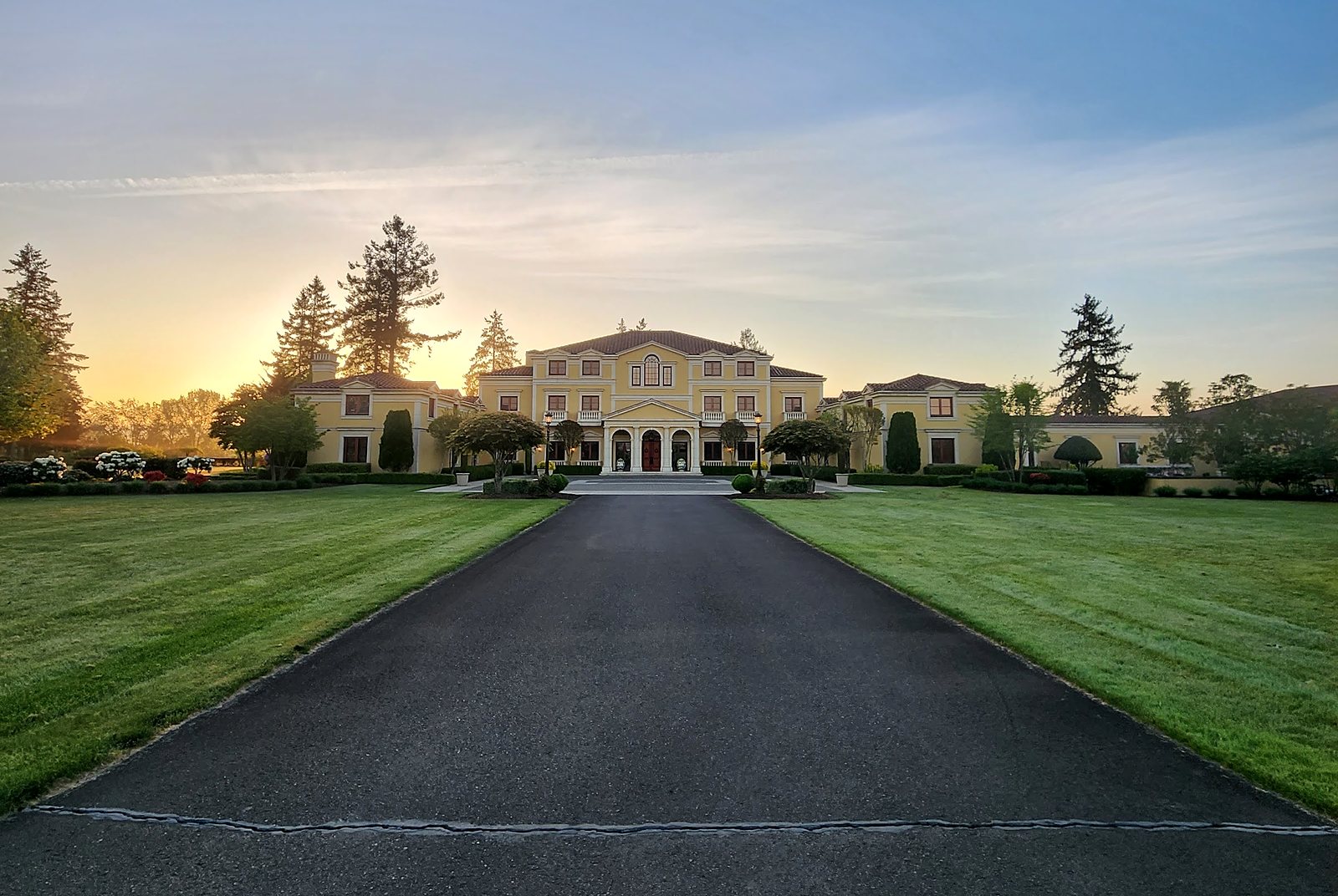 Long driveway leading to the villa at sunrise